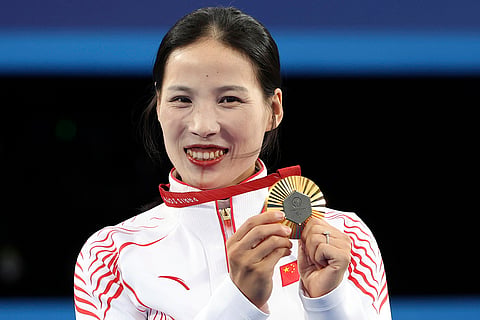 2024 Paris Paralympics: China's Wu Chunyan poses after winning gold in Women's Individual Recurve Open